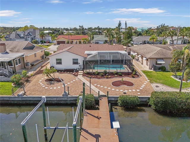 exterior space with a residential view and a water view