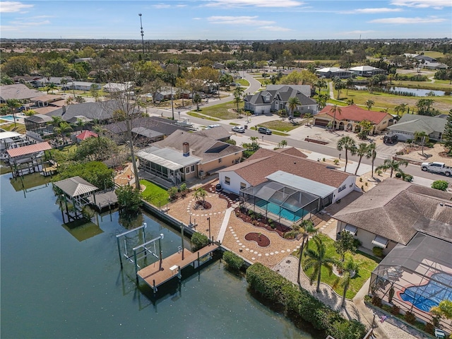 drone / aerial view with a residential view and a water view