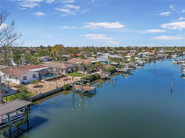 birds eye view of property featuring a water view and a residential view