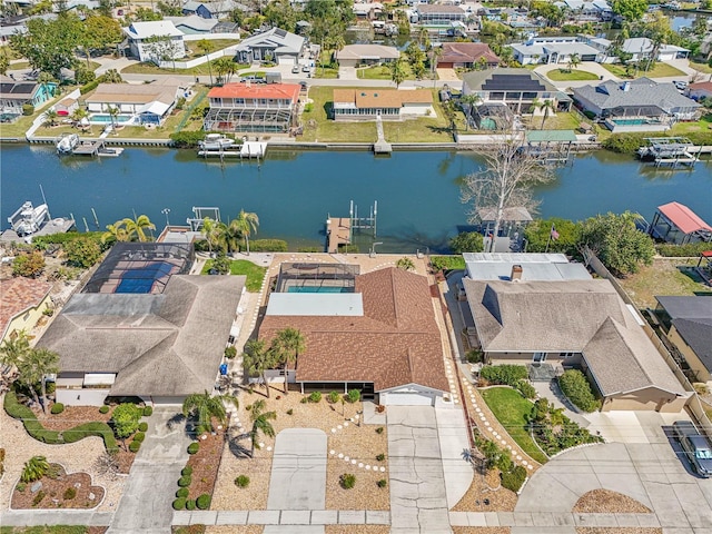 aerial view with a residential view and a water view