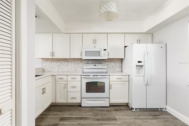 kitchen with white cabinets, white appliances, ornamental molding, and light countertops