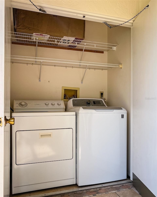 laundry area featuring independent washer and dryer