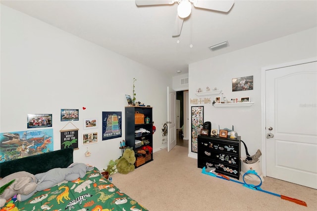 carpeted bedroom with visible vents and a ceiling fan