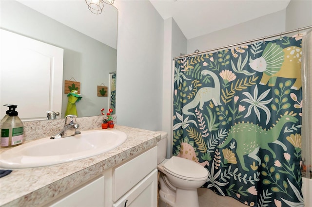 full bathroom with curtained shower, vanity, toilet, and tile patterned floors