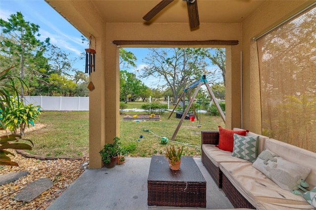 view of patio / terrace with outdoor lounge area, a playground, and fence