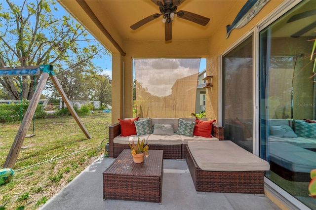 view of patio / terrace with a ceiling fan, a playground, and an outdoor hangout area