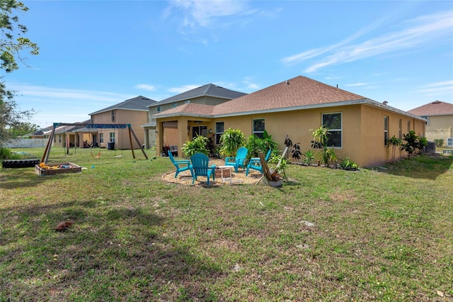 view of yard with fence and a fire pit