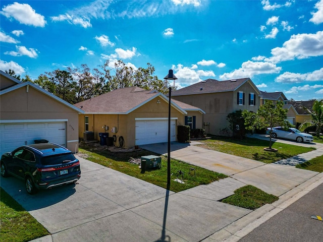 view of front facade featuring a garage, concrete driveway, a front yard, and stucco siding