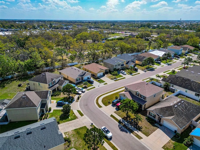 birds eye view of property with a residential view