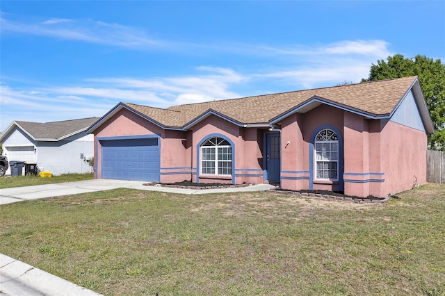 ranch-style home with driveway, a shingled roof, an attached garage, a front lawn, and stucco siding