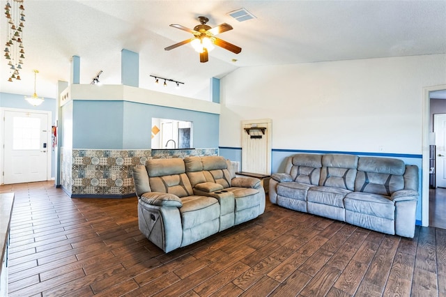 living area with rail lighting, visible vents, ceiling fan, and hardwood / wood-style floors