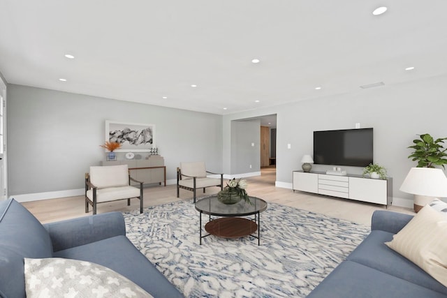 living room featuring baseboards, wood finished floors, and recessed lighting