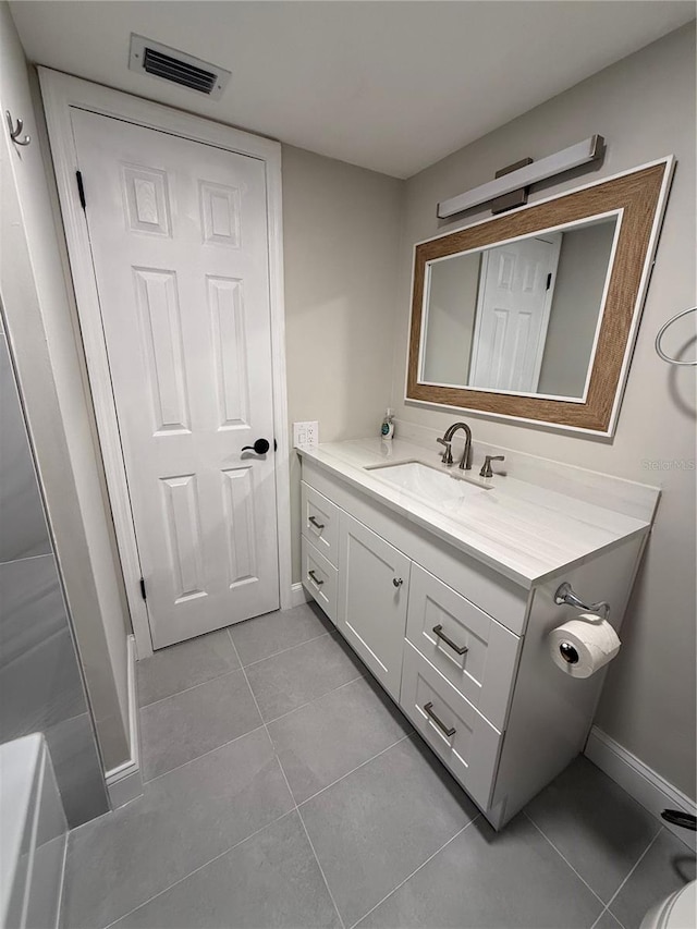 1000 49th St N Unit 309, Saint Petersburg, FL 33710 - bathroom featuring tile patterned flooring, visible vents, baseboards, and vanity