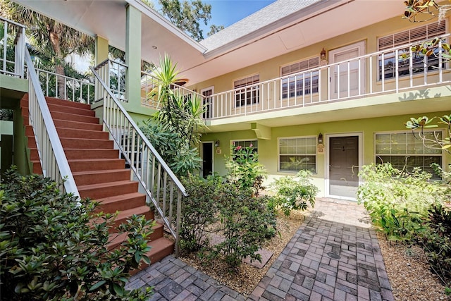 view of exterior entry with stucco siding