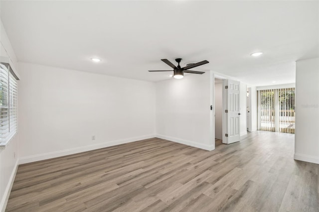 unfurnished room with a ceiling fan, recessed lighting, light wood-style flooring, and baseboards