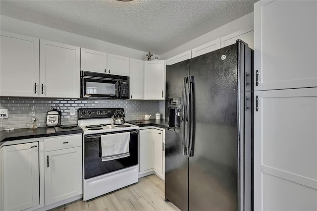 kitchen with tasteful backsplash, dark countertops, light wood-type flooring, black appliances, and white cabinetry