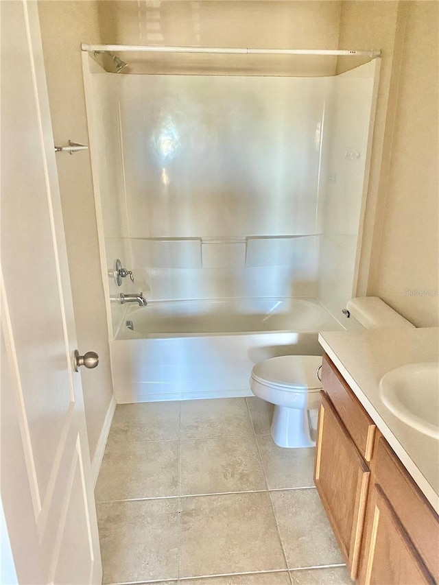 bathroom featuring toilet, tile patterned flooring, vanity, and shower / bathtub combination