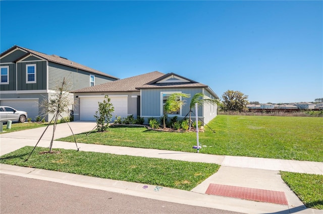 view of front facade with concrete driveway, an attached garage, and a front lawn