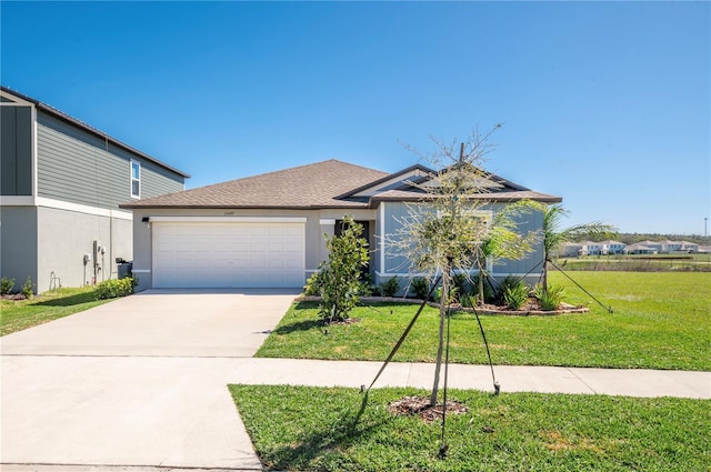 view of front facade with concrete driveway, stucco siding, roof with shingles, an attached garage, and a front yard