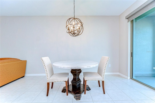 dining area featuring a chandelier, light tile patterned flooring, and baseboards