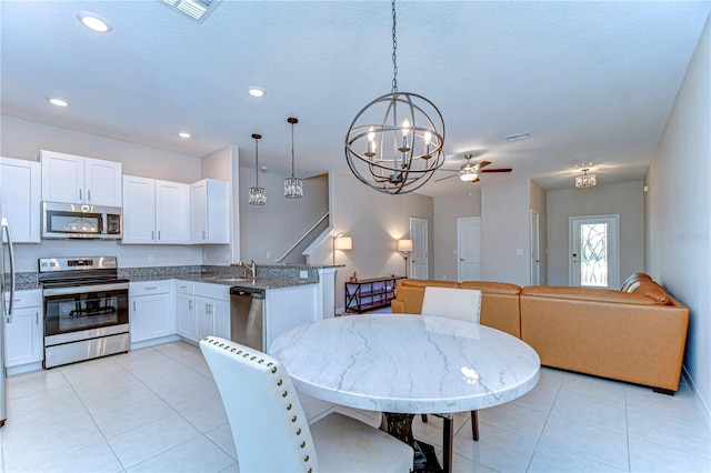 dining area with recessed lighting, light tile patterned flooring, ceiling fan, and visible vents