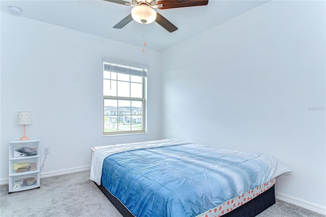 bedroom with carpet floors, baseboards, and a ceiling fan