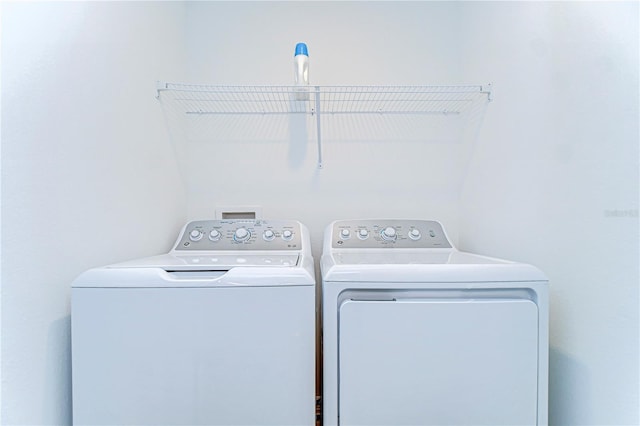 clothes washing area with laundry area and washing machine and dryer