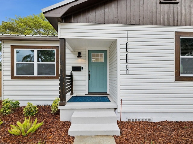 doorway to property featuring crawl space