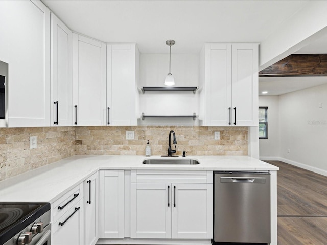 kitchen with decorative backsplash, stainless steel dishwasher, wood finished floors, white cabinetry, and a sink