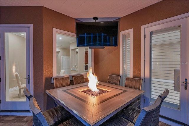 dining area featuring a textured wall