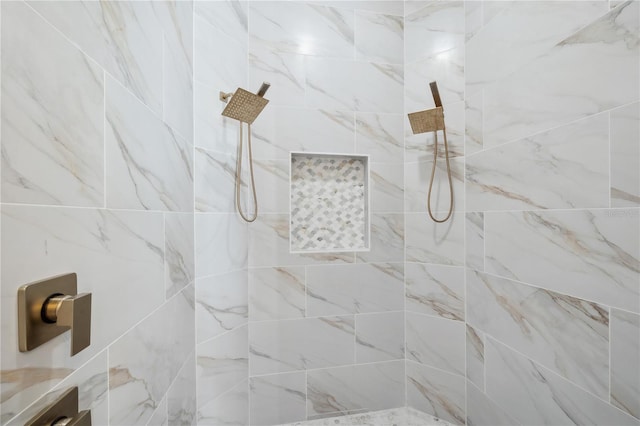 bathroom with a tile shower