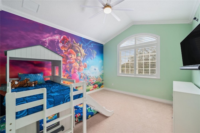 carpeted bedroom featuring lofted ceiling, visible vents, ornamental molding, ceiling fan, and baseboards