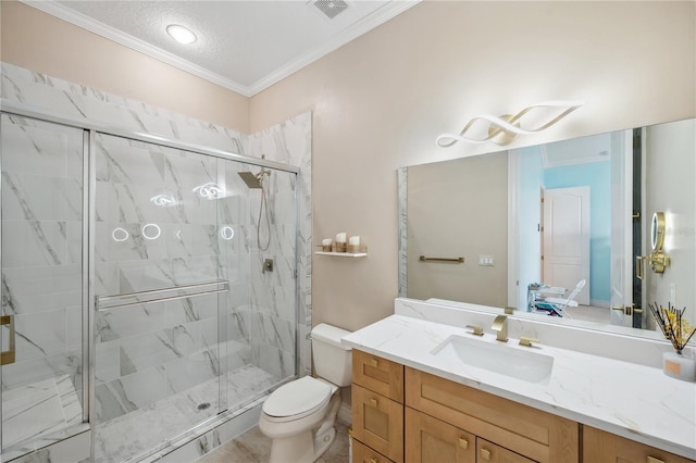 full bath featuring crown molding, a marble finish shower, visible vents, toilet, and vanity