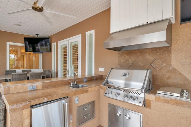 view of patio with exterior kitchen, a grill, a sink, and ceiling fan