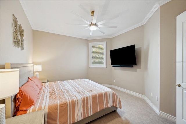 carpeted bedroom featuring baseboards, ornamental molding, and ceiling fan