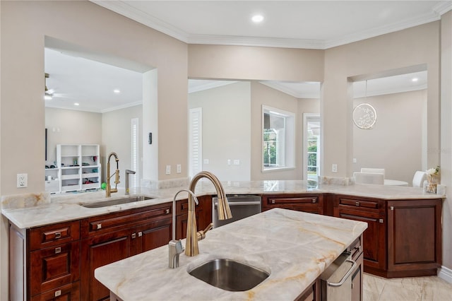 kitchen with ceiling fan, a sink, and crown molding