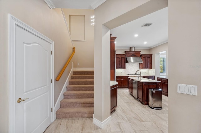 stairway with ornamental molding, recessed lighting, visible vents, and baseboards