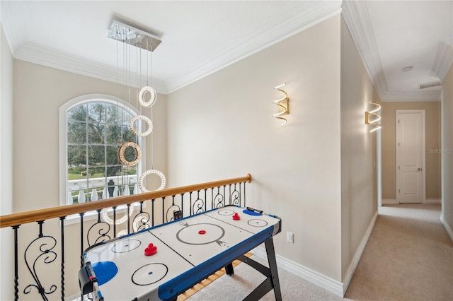 game room featuring baseboards, ornamental molding, and carpet flooring