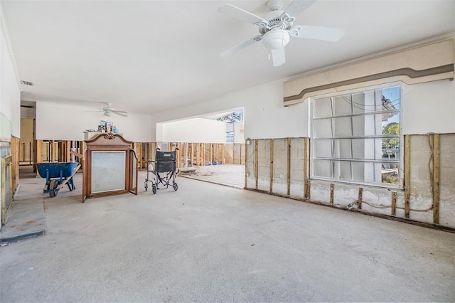 unfurnished room featuring visible vents and a ceiling fan