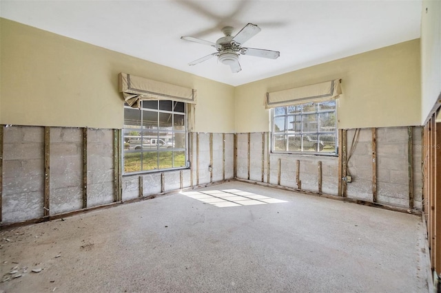 unfurnished room with a ceiling fan