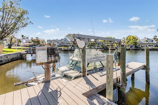 view of dock featuring a water view and boat lift