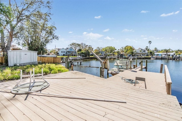 dock area featuring a water view and boat lift