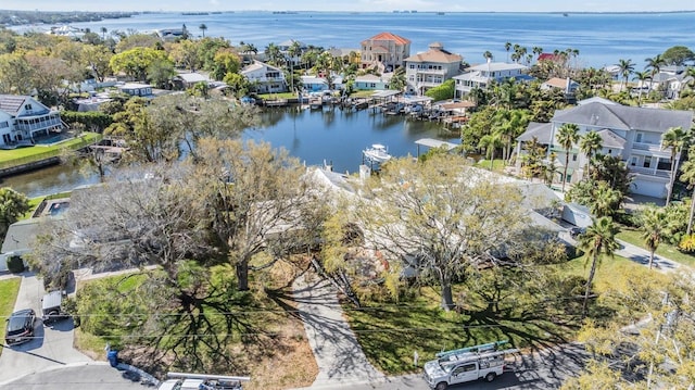 drone / aerial view featuring a residential view and a water view