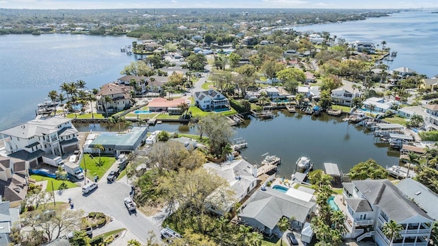 bird's eye view featuring a water view and a residential view