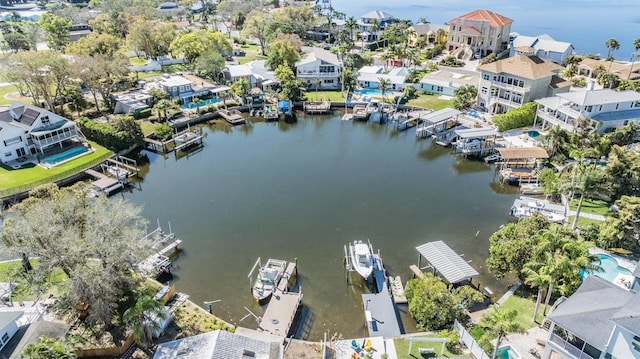 drone / aerial view with a water view and a residential view