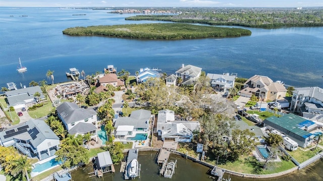 bird's eye view with a water view and a residential view