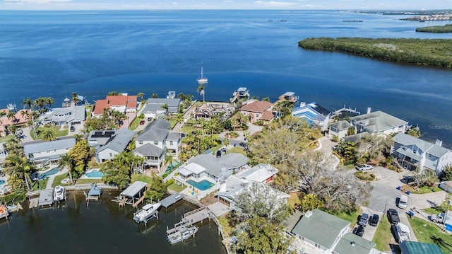 drone / aerial view with a residential view and a water view