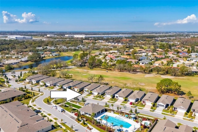 birds eye view of property with a water view, a residential view, and golf course view