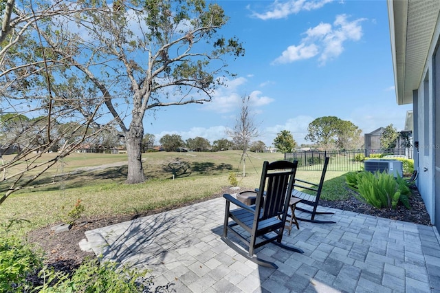 view of patio featuring fence and central AC unit