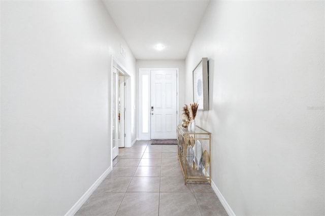 9119 Forge Breeze Loop, Wesley Chapel, FL 33545 - entryway with baseboards and light tile patterned floors